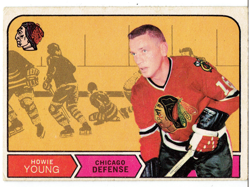 Vintage hockey trading card of Howie Young in a Chicago Blackhawks jersey with game action illustration.
